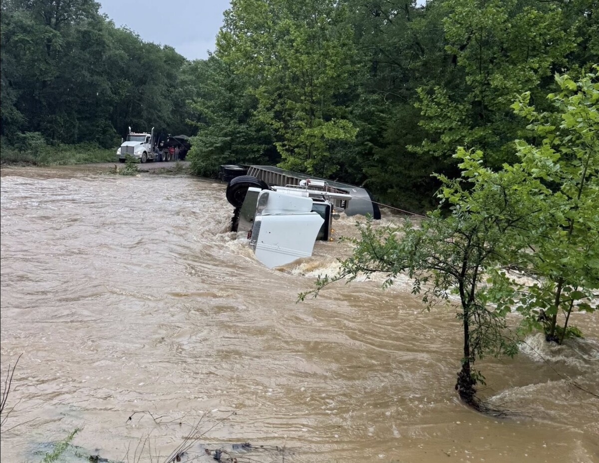 Truck driver hauling gravel rescued after attempting to drive through flood waters in Oklahoma