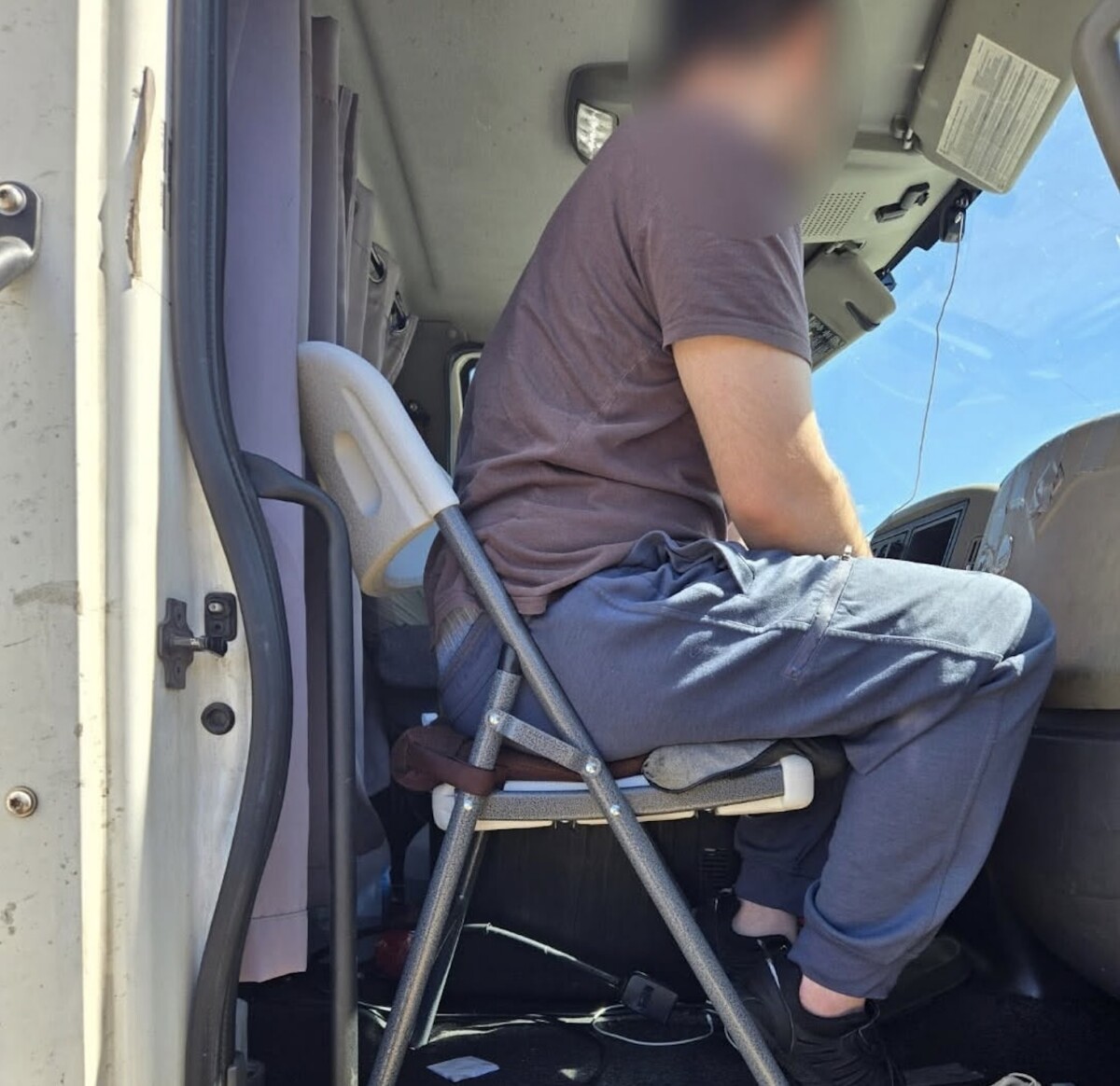 Semi truck passenger found perched on folding chair during traffic stop in Arizona