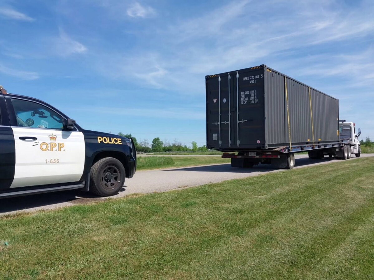 Driver and trucking company face 17 charges after defying out-of-service order and switching out plates, cops say