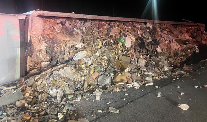 Truck driver ticketed for rollover crash that spilled garbage in NYS Thruway Service Area parking lot