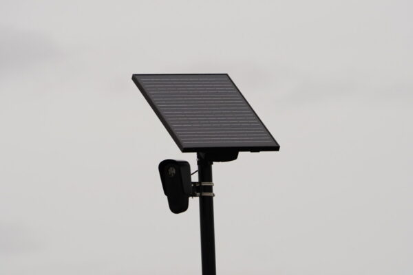 Flock safety police law enforcement license plate reader set up outside to help catch vehicle speeders.