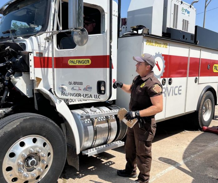 OHP trooper inspecting a commercial vehicle