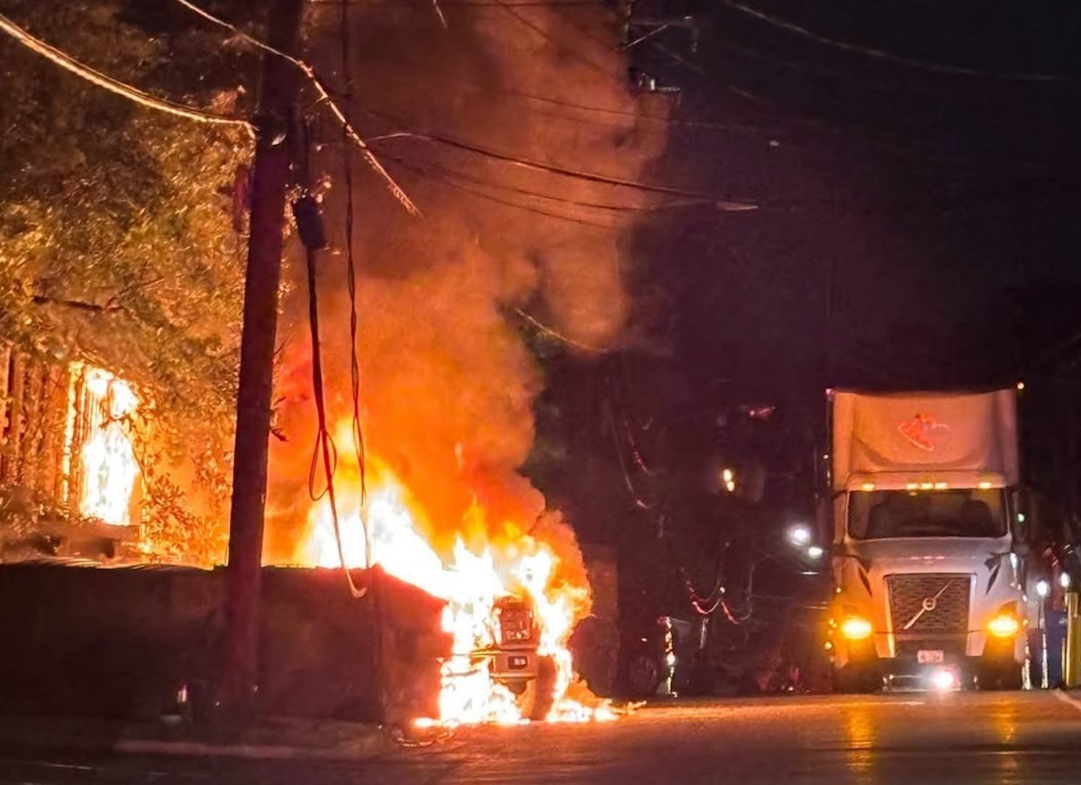 Fire spreads after semi truck pulls down electrical wires