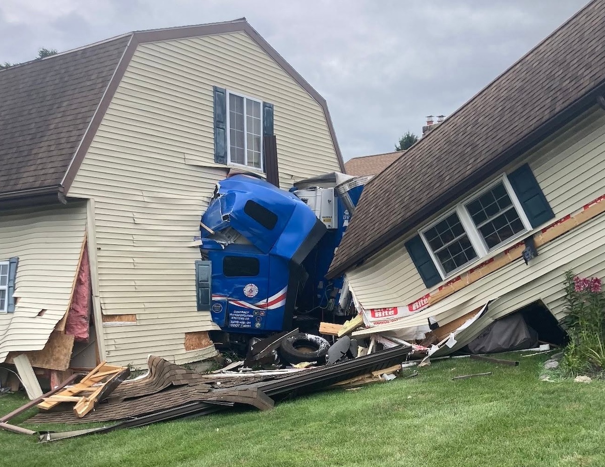 Garage obliterated after collision with car sends semi truck veering into residential home
