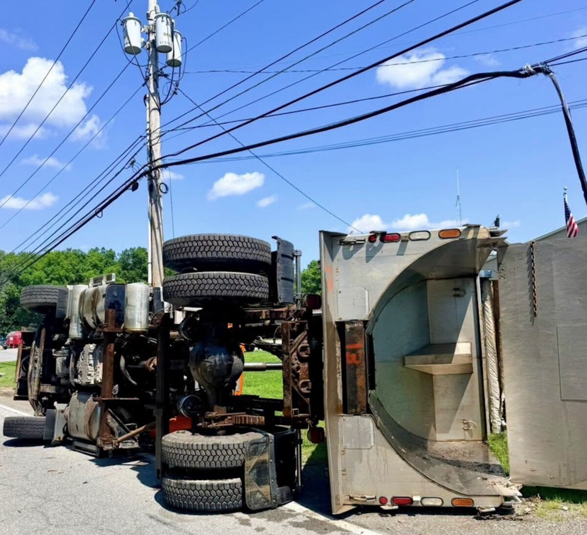 New York troopers call out driver inattention after dump truck strikes communication lines