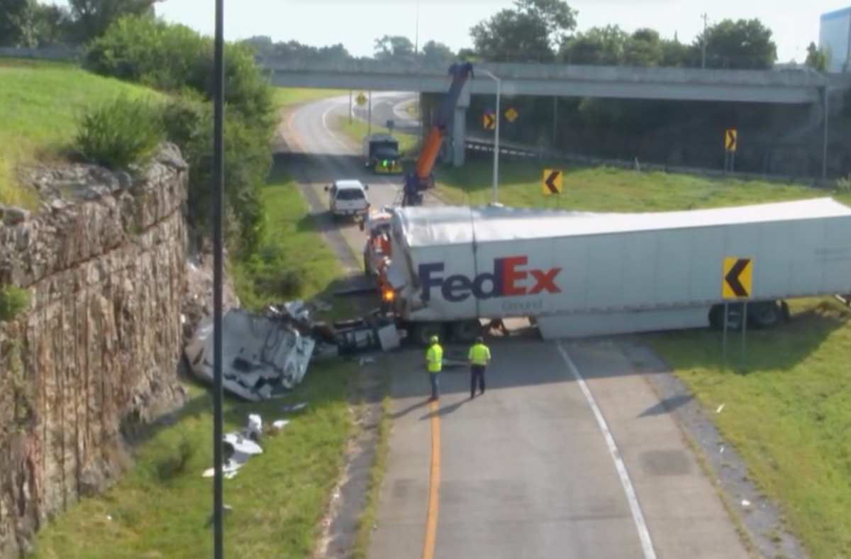 Two dead in crash off curved exit ramp into roadside rock wall